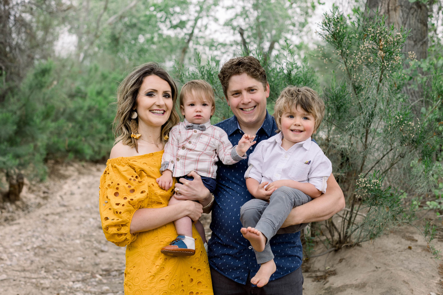 Beechy Family of four outdoors with a natural background