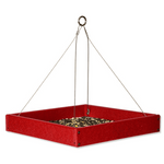 Bright Red square bird feeder with seeds on a white background